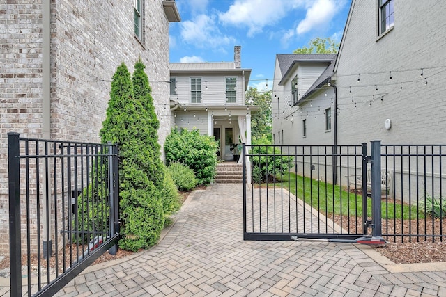 view of gate with a fenced front yard