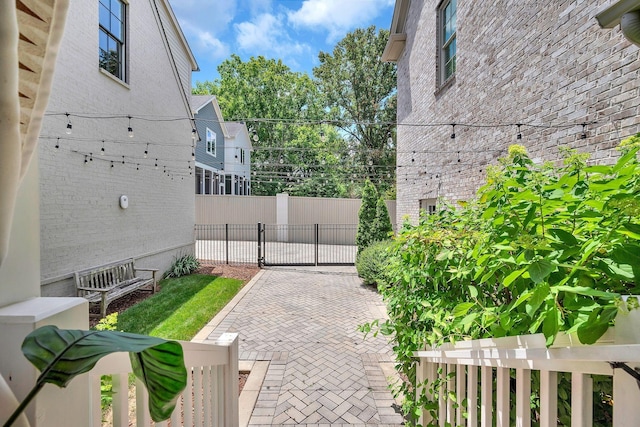 view of patio / terrace with fence and a gate