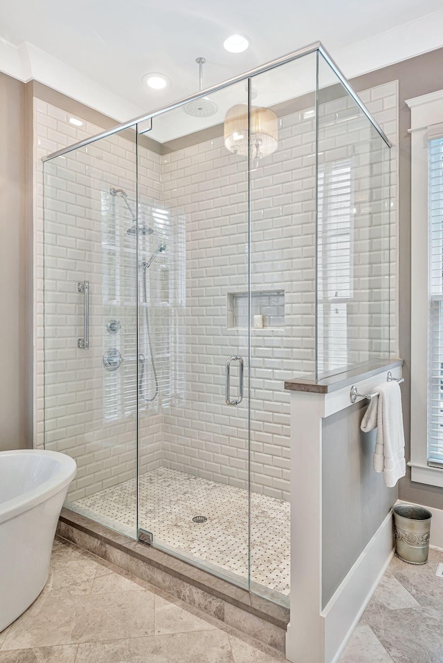 full bathroom featuring recessed lighting, a shower stall, and baseboards