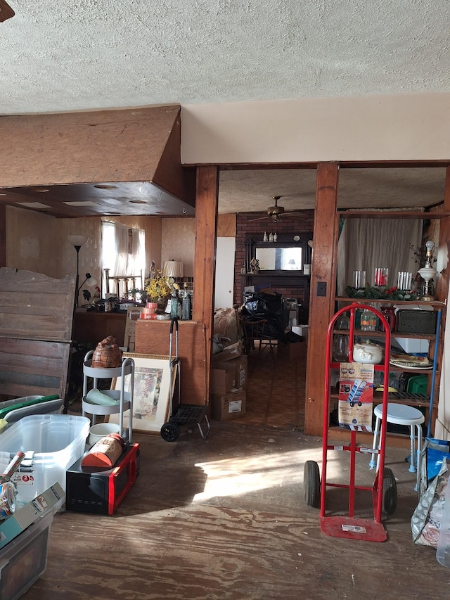 below grade area featuring a textured ceiling and wood finished floors