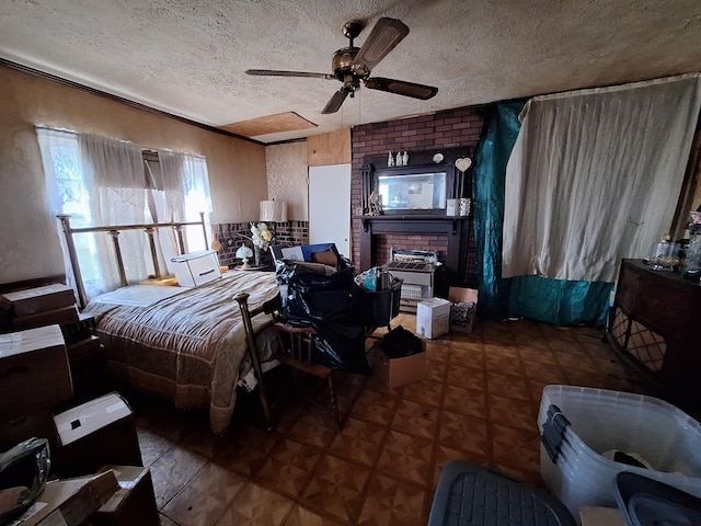 bedroom featuring a textured ceiling and a ceiling fan