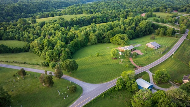 bird's eye view featuring a rural view and a view of trees