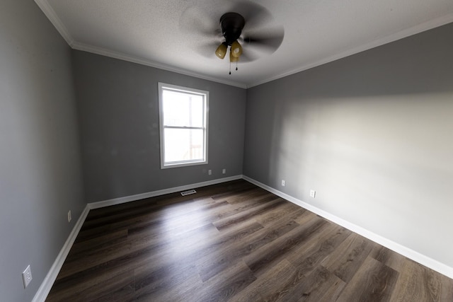 unfurnished room featuring ceiling fan, visible vents, baseboards, ornamental molding, and dark wood-style floors