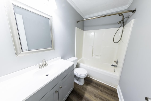 bathroom with toilet, shower / bathing tub combination, vanity, and crown molding