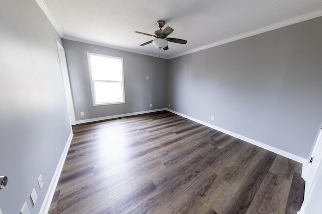 empty room with crown molding, dark wood-type flooring, ceiling fan, a textured ceiling, and baseboards