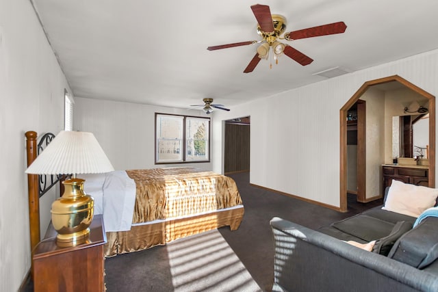 bedroom featuring a ceiling fan, dark colored carpet, and visible vents