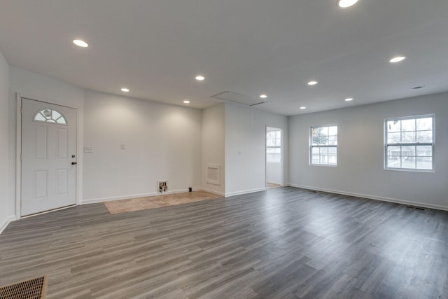 spare room with recessed lighting, dark wood-style flooring, and baseboards