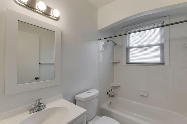 bathroom with toilet, bathing tub / shower combination, and vanity