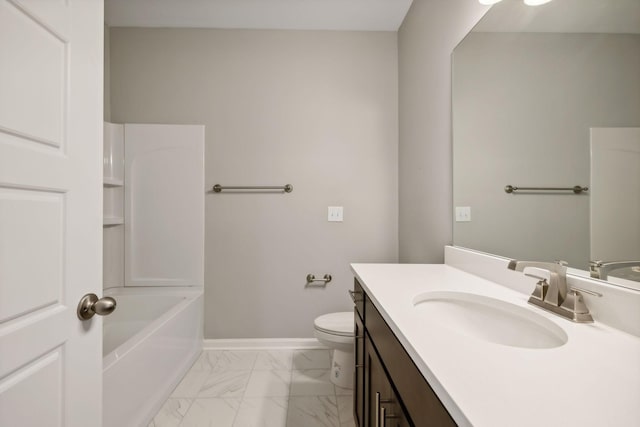 bathroom featuring marble finish floor, vanity, toilet, and baseboards