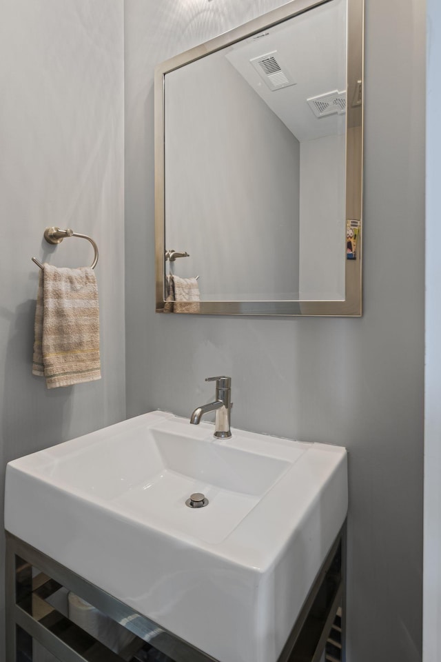 bathroom with a sink and visible vents