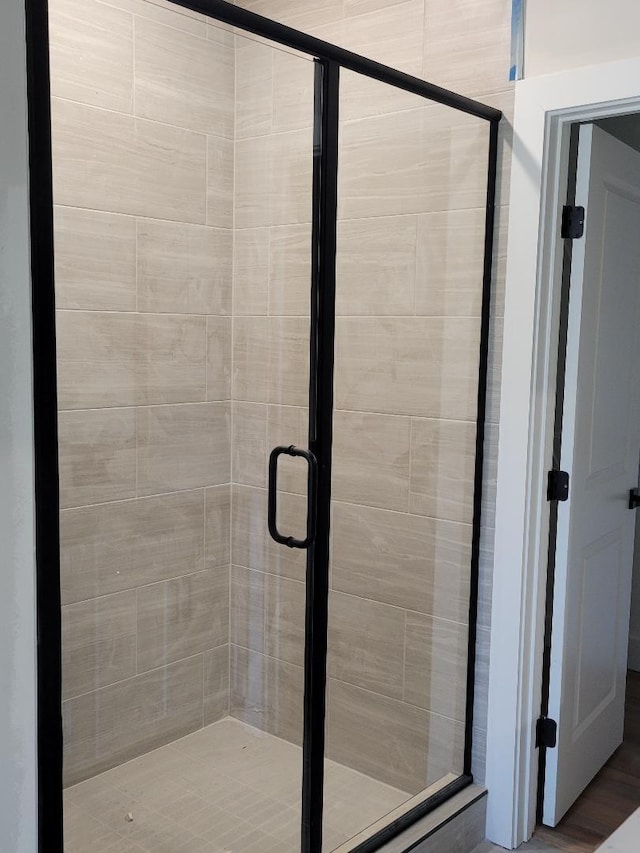 full bathroom featuring a shower stall