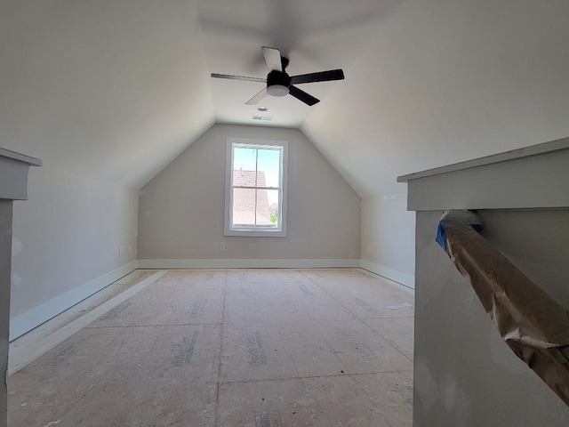 bonus room featuring lofted ceiling, ceiling fan, visible vents, and baseboards