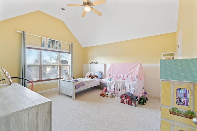 bedroom with light carpet, visible vents, baseboards, a ceiling fan, and lofted ceiling