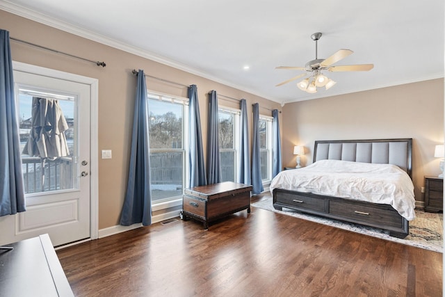 bedroom featuring ornamental molding, dark wood finished floors, and baseboards