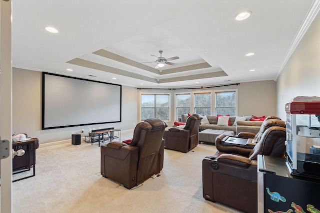 cinema room featuring light carpet, a raised ceiling, ceiling fan, crown molding, and recessed lighting