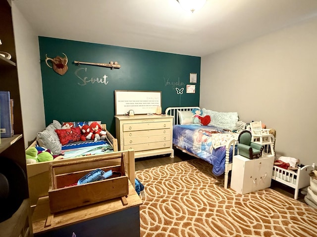 bedroom featuring wood finished floors