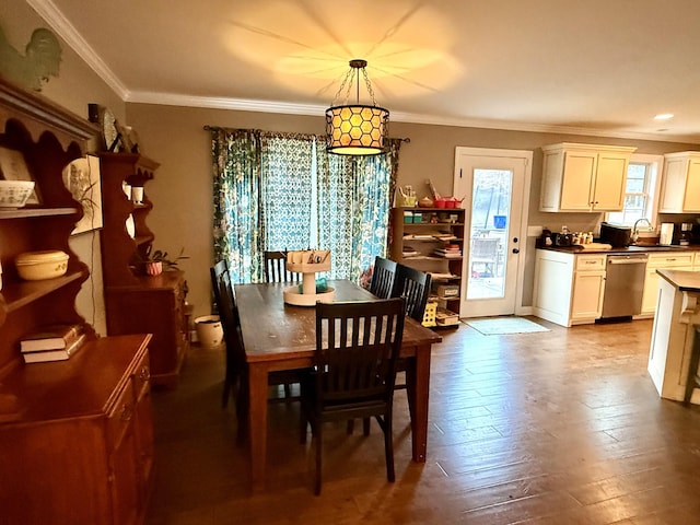 dining area with ornamental molding and wood finished floors