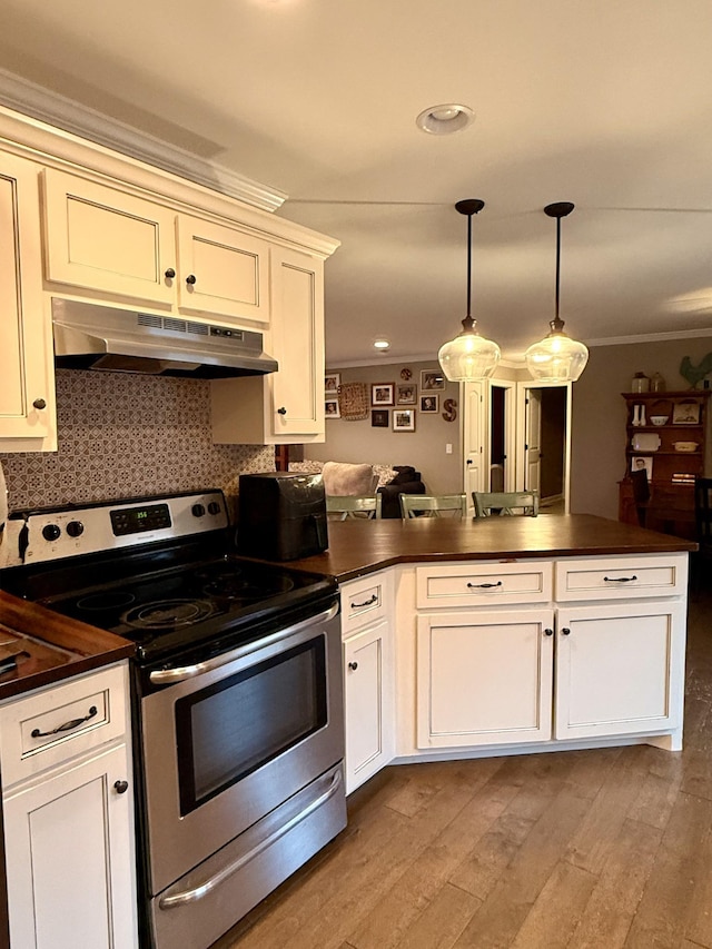 kitchen with electric range, dark countertops, and under cabinet range hood