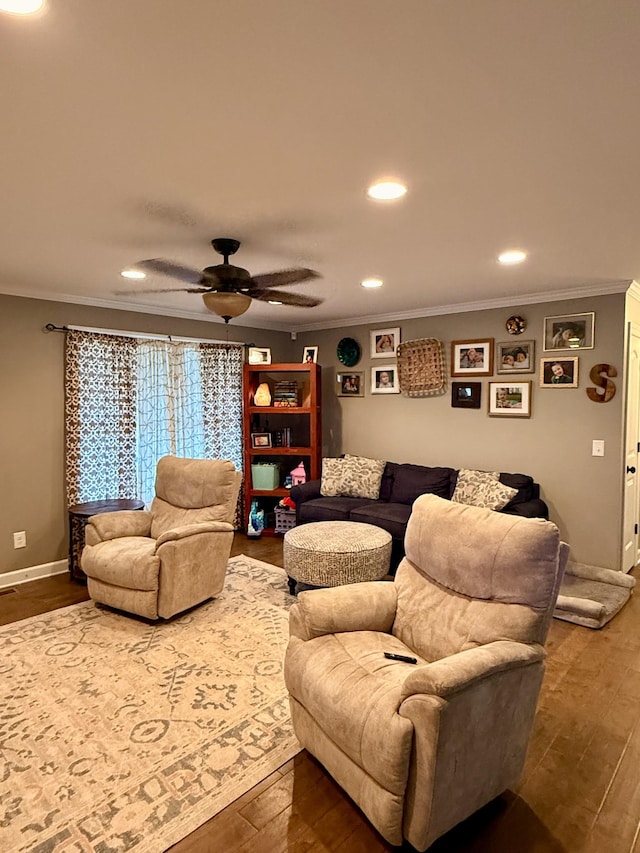 living area featuring ornamental molding, recessed lighting, wood finished floors, and baseboards