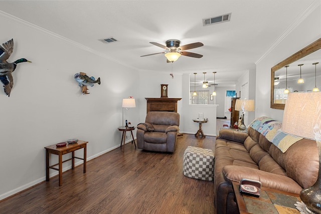 living area with a ceiling fan, dark wood-style flooring, visible vents, and crown molding