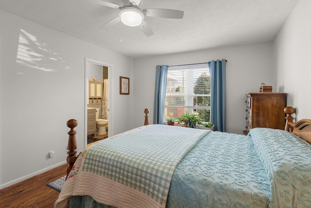 bedroom featuring ceiling fan, a textured ceiling, baseboards, and wood finished floors