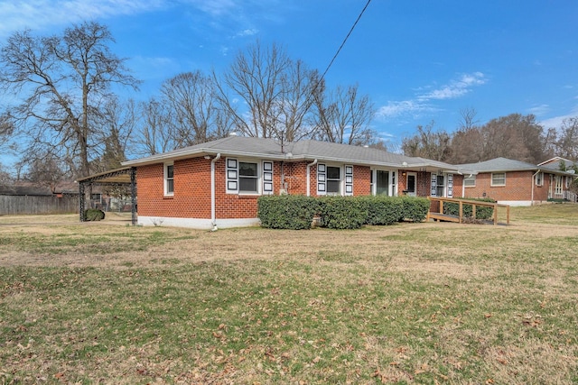 view of front of home featuring a front lawn and brick siding