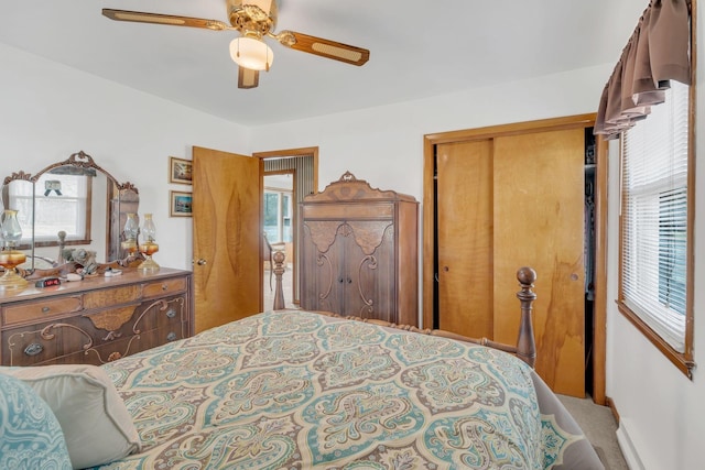 bedroom with carpet floors, a ceiling fan, and a closet