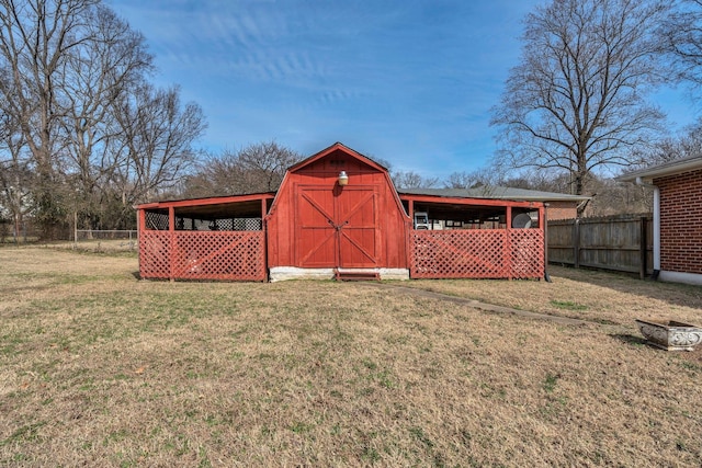 view of shed featuring fence