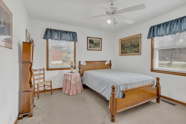 bedroom featuring carpet, visible vents, and baseboards