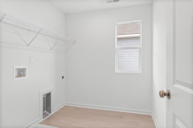 clothes washing area with laundry area, light wood finished floors, baseboards, hookup for a washing machine, and hookup for an electric dryer