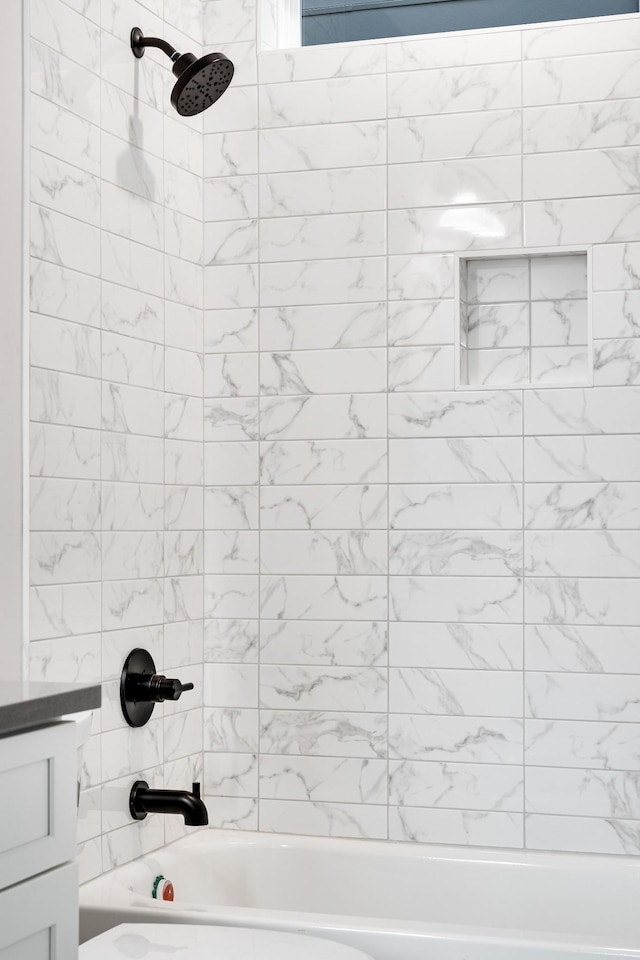 bathroom with shower / washtub combination and vanity