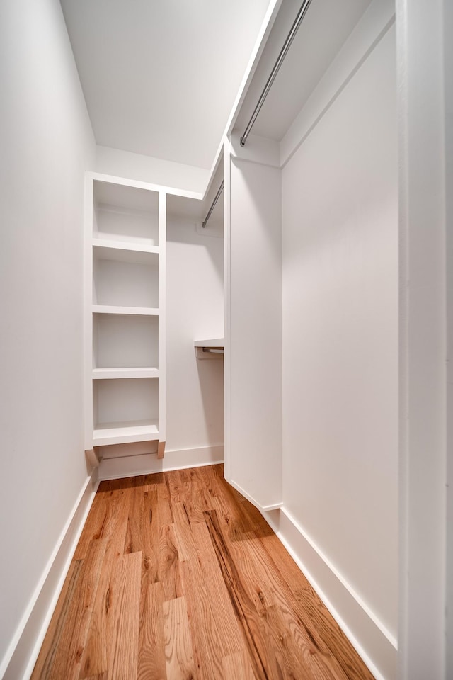 spacious closet with light wood-style flooring