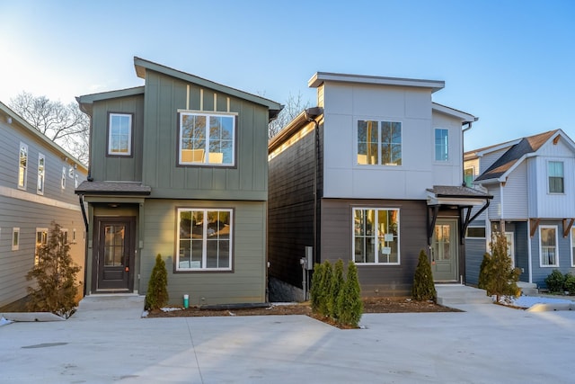 contemporary home featuring board and batten siding