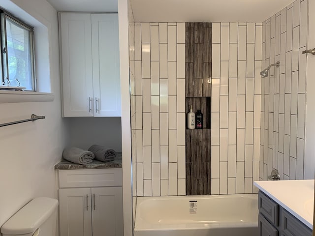 full bathroom with vanity, bathtub / shower combination, and toilet