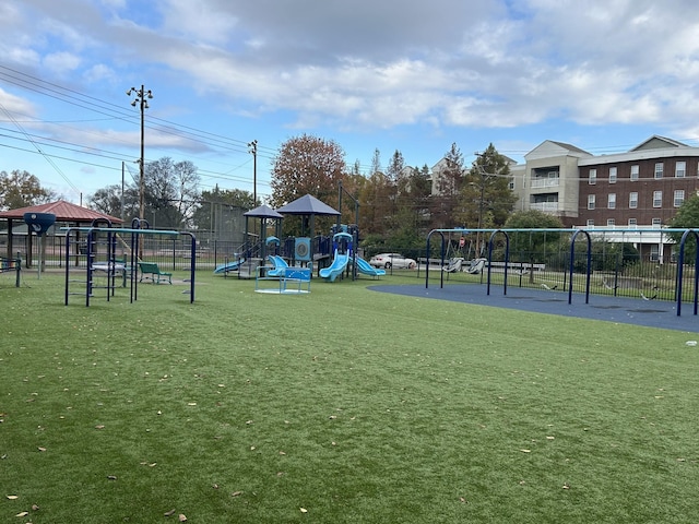 community playground with a lawn and fence