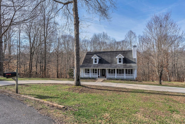 cape cod-style house with a porch, a chimney, and a front lawn