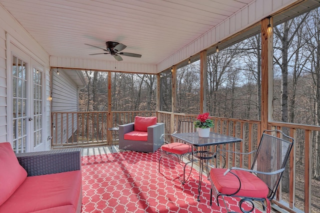 sunroom with a ceiling fan