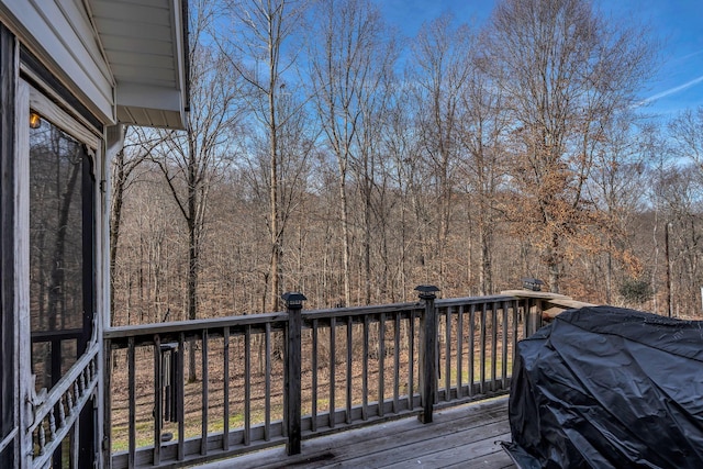 wooden deck featuring grilling area