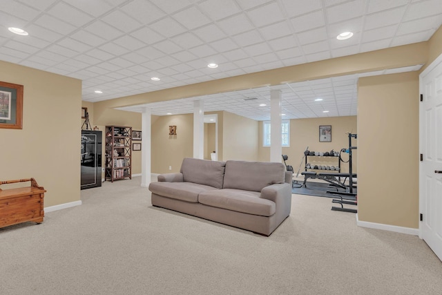 living room featuring recessed lighting, light carpet, and baseboards