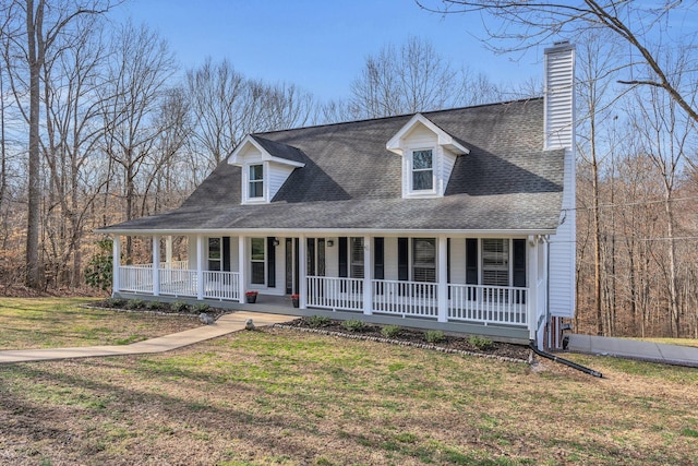 view of front facade featuring covered porch, roof with shingles, a chimney, and a front lawn