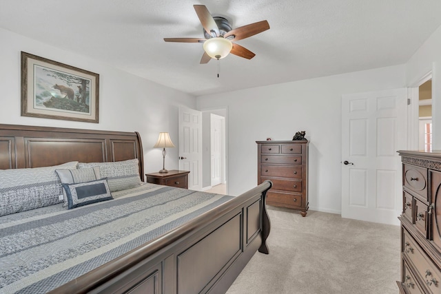 bedroom with light carpet and ceiling fan