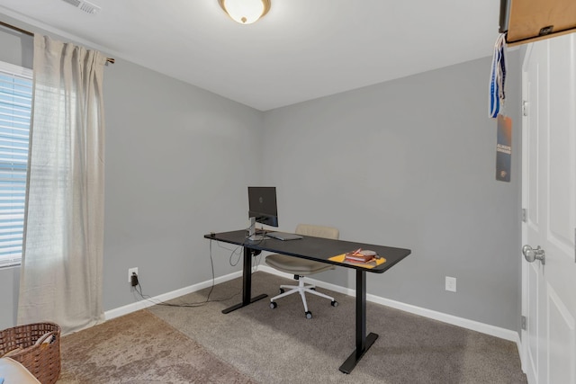 office area featuring carpet and baseboards