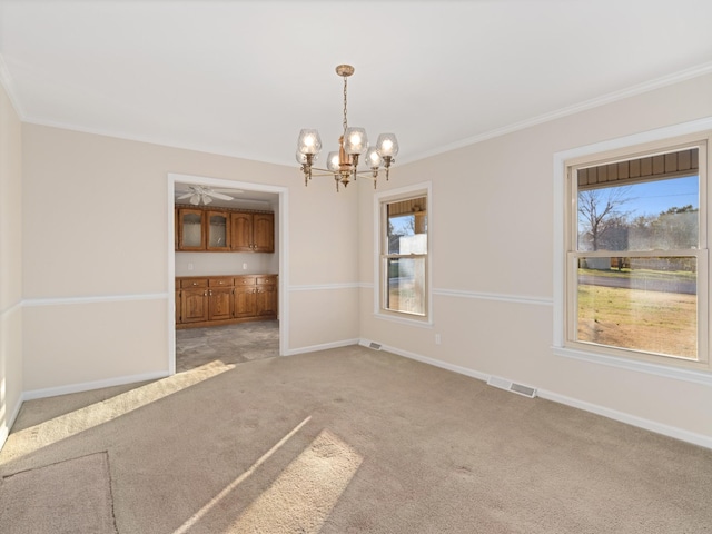 interior space with light carpet, baseboards, visible vents, and ornamental molding