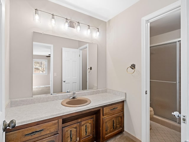 full bath featuring toilet, a shower stall, and vanity