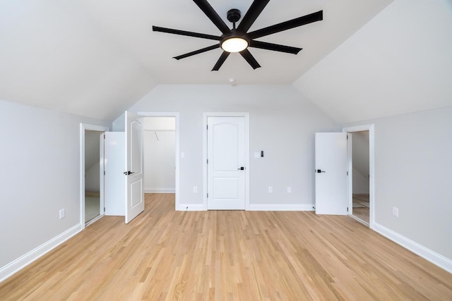 bonus room with lofted ceiling, light wood-style flooring, and baseboards