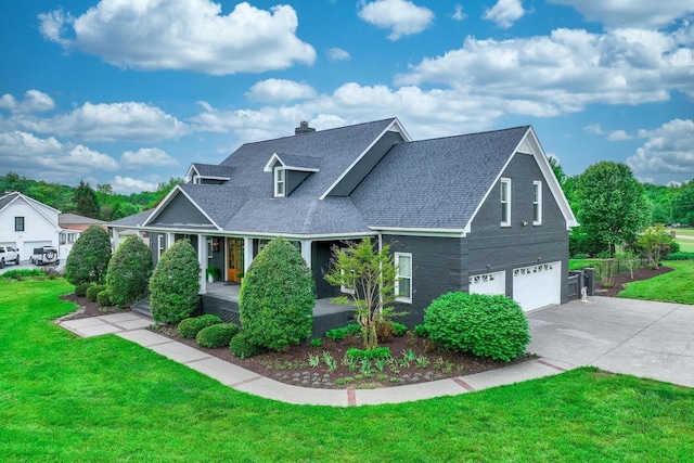 view of front facade featuring a garage, a shingled roof, driveway, a chimney, and a front yard