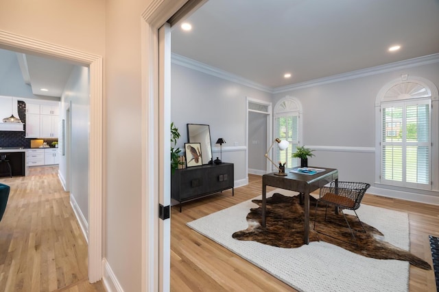 home office with ornamental molding, recessed lighting, baseboards, and light wood finished floors