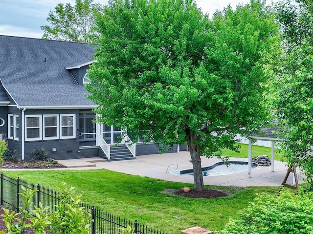 rear view of house featuring a patio, fence, a sunroom, roof with shingles, and a fenced in pool