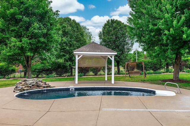 view of swimming pool featuring a fenced in pool, a patio area, fence, and a gazebo