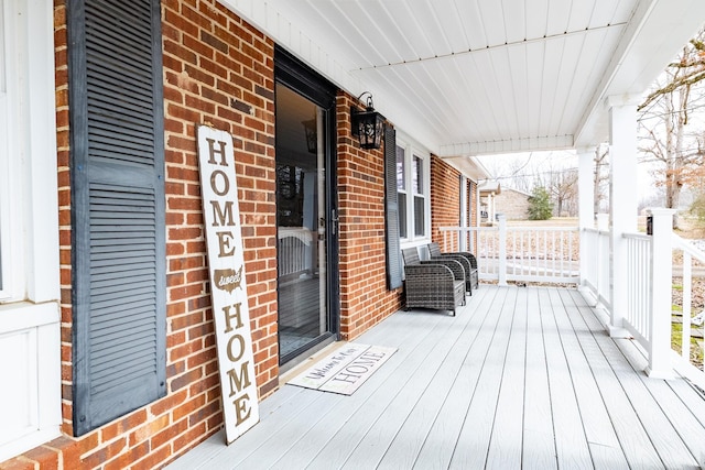 wooden terrace with a porch
